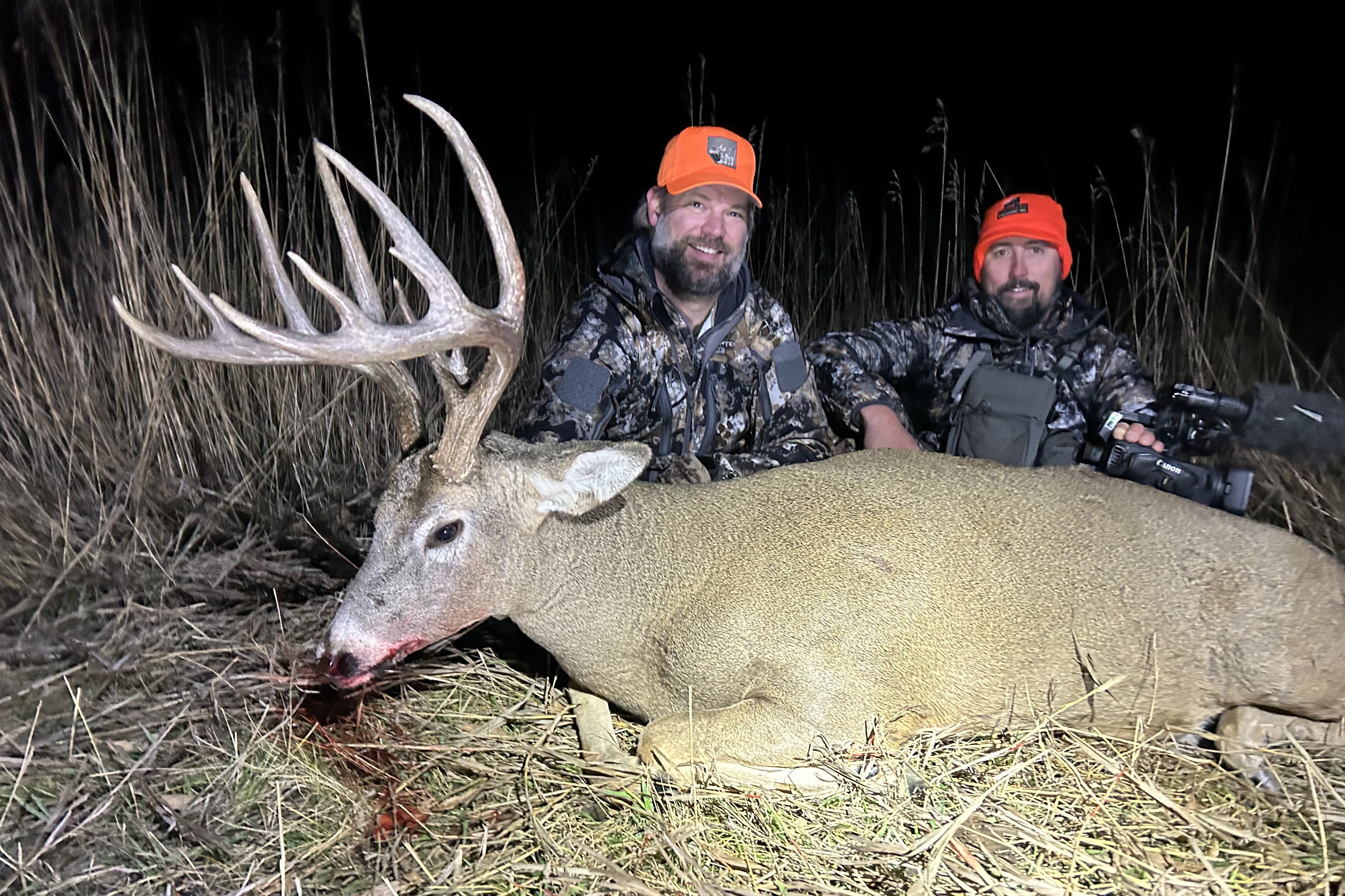 Hunters with a trophy whitetail at last light in Northeast Montana